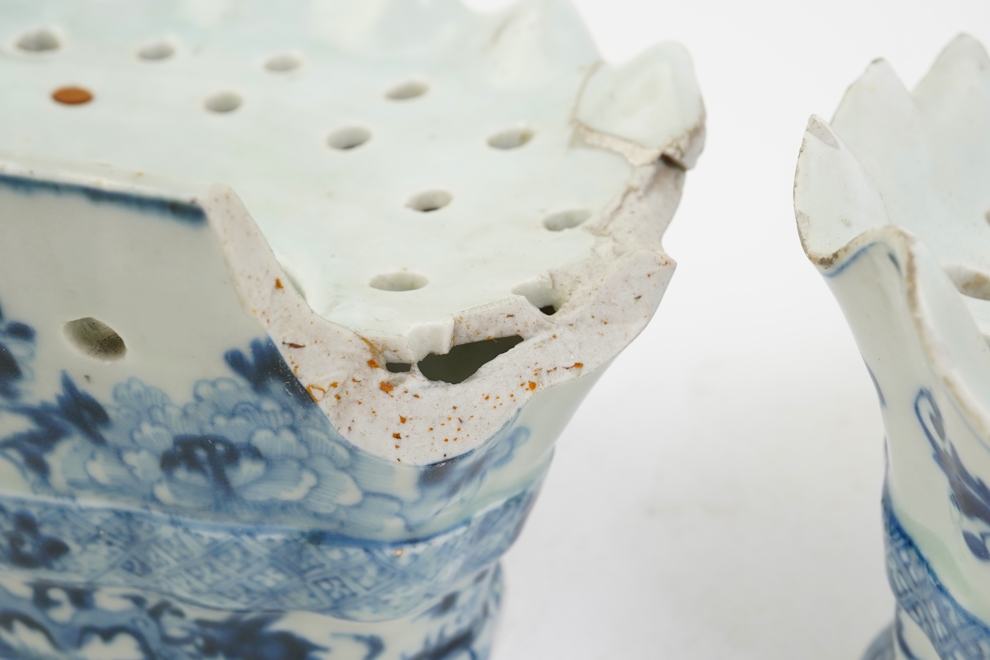 A pair of unusual Chinese export blue and white bough pots, after a Delft model, Qianlong period